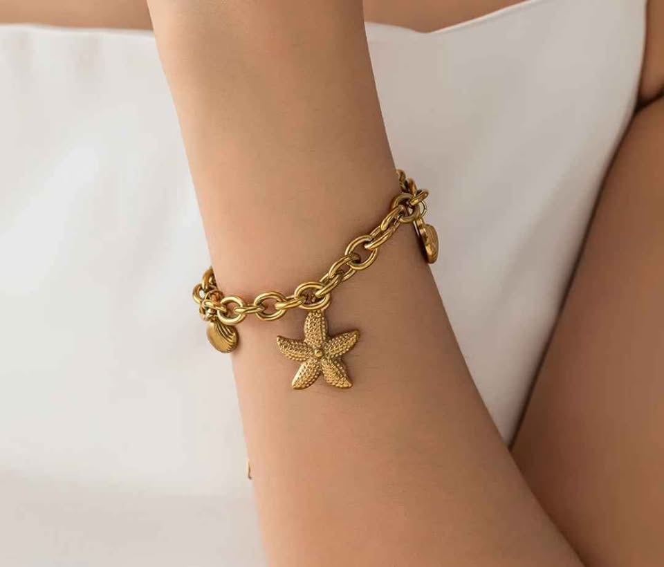 Chunky Gold Tone Ocean Charm Bracelet