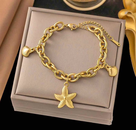 Chunky Gold Tone Ocean Charm Bracelet